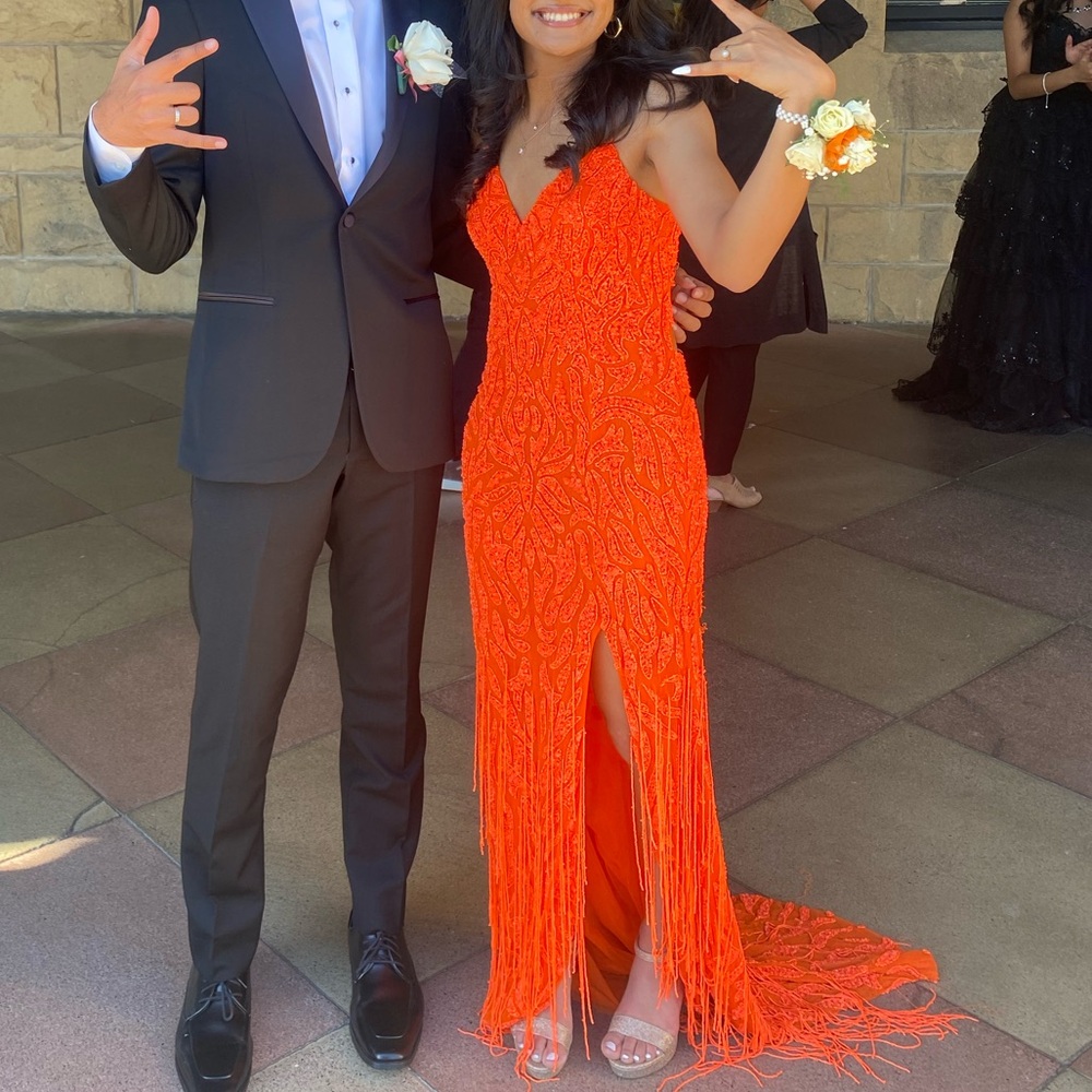 A stunning neon orange Jovani prom dress, worn once